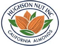 Hughson Nut Inc California Almonds logo in dark blue outlined oval with brown coloured nuts inside the center in a cluster with leaves around it