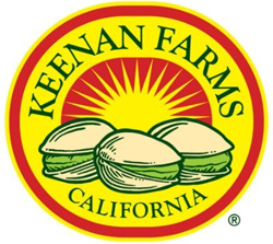 Keenan Farms California logo inside of red outline circle with yellow background with illustration in green outline of three pistachios with yellow and red sun in background with rays